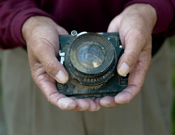 Mayumi Suzuki found this camera in the rubble of her father’s photo studio, which survived the March 2011 tsunami. Suzuki was told the camera’s lens was unusable, but she has utilized it, uncleaned, to take a series of black-and-white photographs of the community. | © Mayumi Suzuki