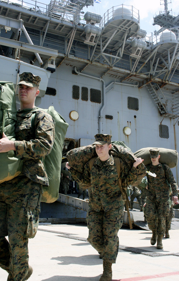 
U.S. Marines arrive at White Beach naval facility in Uruma, Okinawa Prefecture, in April 2011, after taking part in Operation Tomodachi. | KYODO
                      